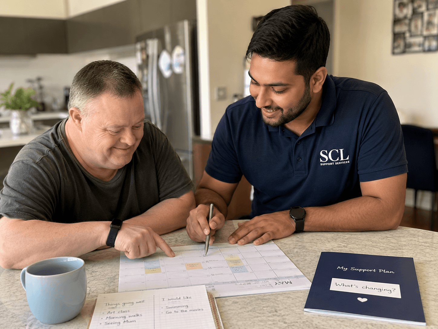 Participant and SCL Support Services worker reviewing a support schedule together.